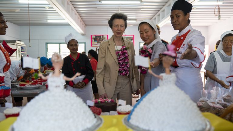 Anne is shown Barbie cakes during a visit to the school&#39;s cooking laboratory