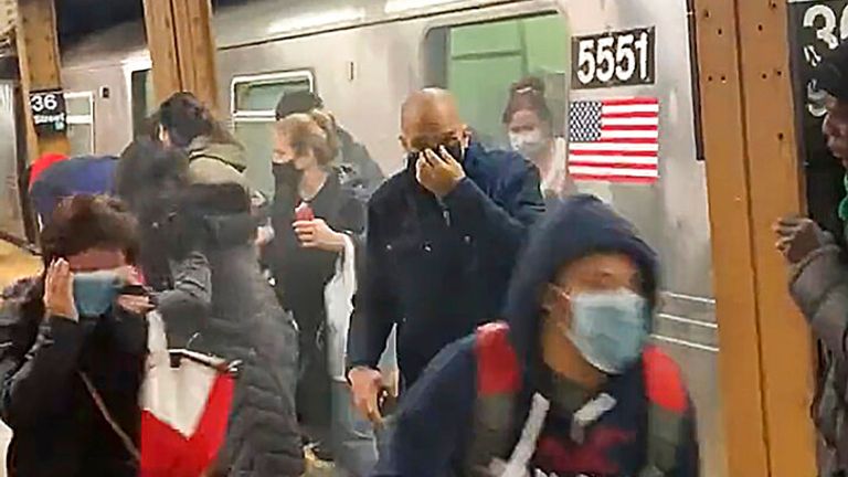 Passengers are seen fleeing the subway train carriage during the attack. Pic: AP