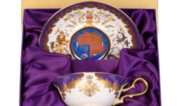 The tea set is inspired by the purple and gold succession dress worn by the Queen at her coronation. 