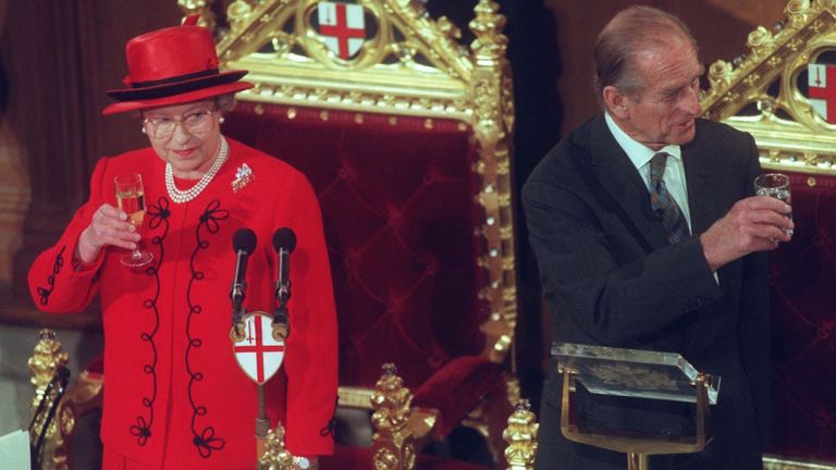 The Queen and the Duke of Edinburgh, each raise a glass to toast their Golden Wedding Anniversary during a lunch given by the Lord Mayor of London today (Wednesday). See PA story ROYAL Gala. REUTERS ROTA