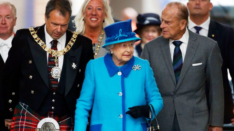 The Queen arrives at Waverley Station, in Edinburgh, on the day she becomes Britain&#39;s longest reigning monarch
