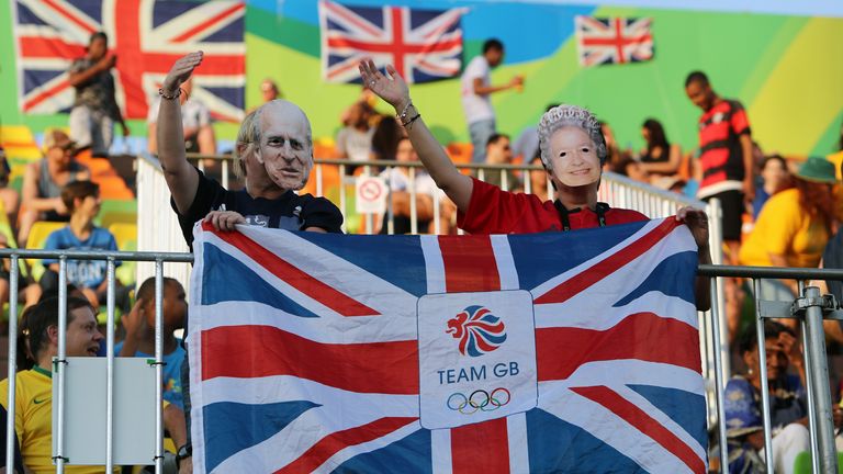 Great Britain fans wear masks of Queen Elizabeth II and Prince Philip at the Deodoro Stadium on the first day of the Rio Olympics Games, Brazil. PRESS ASSOCIATION Photo. Picture date: Friday August 5, 2016. Photo credit should read: David Davies/PA Wire. RESTRICTIONS - Editorial Use Only.