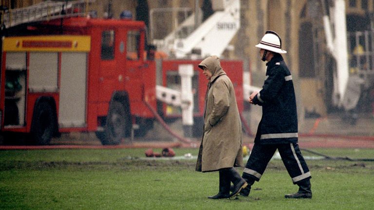 The Queen surveys the damage caused by the fire at Windsor Castle