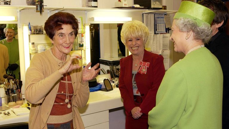 28-Nov-2001  The Queen during her visit, to Elstree Studios where the famous British soap EastEnders is filmed. The Queen was accompanied by long standing cast member Barbara Windsor, who plays Peggy Mitchell and she met in the make up room June Brown, who plays Dot Cotton.