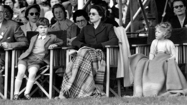 Prince Charles and Princess Anne accompany the Queen to the Royal Windsor Horse Show in May 1955
