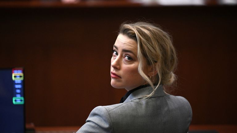 Actor Amber Heard sits in the courtroom during the Johnny Depp vs Heard defamation case at Fairfax County Circuit Court, Virginia, U.S., April 12, 2022. Brendan Smialowski/Pool via REUTERS
