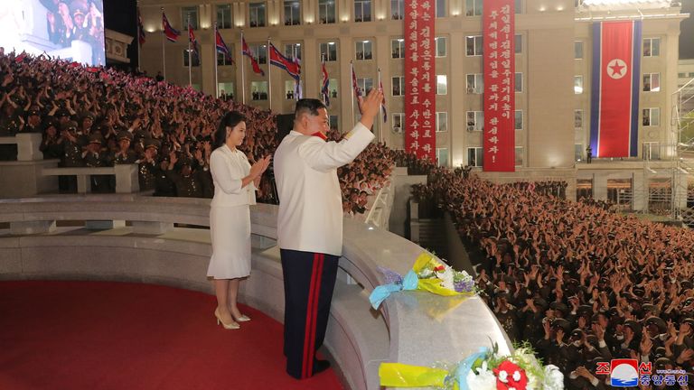 North Korean leader Kim Jong Un and his wife Ri Sol Ju attend a nighttime military parade to mark the 90th anniversary of the founding of the Korean People&#39;s Revolutionary Army?in Pyongyang, North Korea