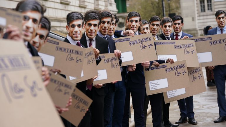 Campaigners dressed as Rishi Sunak protest outside the Treasury office, London, to coincide with the increase in National Insurance Contributions coming into effect. Picture date: Wednesday April 6, 2022.
