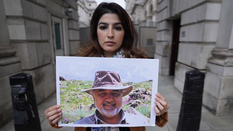 Roxanne Tahbaz, holds a picture of her father Morad Tahbaz, who is jailed in Iran, during a protest outside the Foreign, Commonwealth and Development Office (FCDO) in London, which houses the office of the Foreign Secretary Liz Truss after what she says has been a betrayal of her father by the UK Government.
