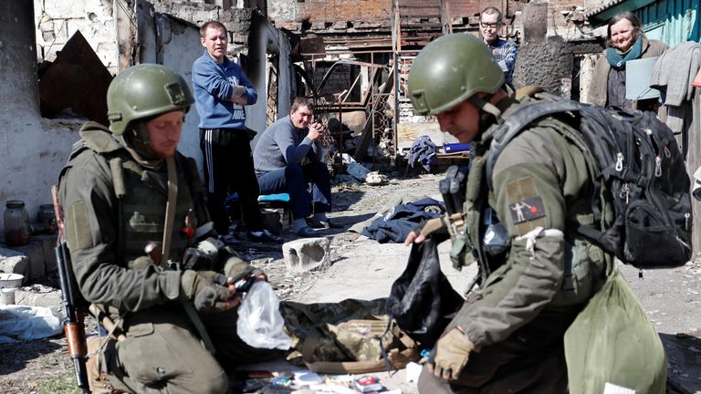 Service members of pro-Russian troops carry out a search of a house during Ukraine-Russia conflict in the southern port city of Mariupol, Ukraine April 7, 2022. REUTERS/Alexander Ermochenko
