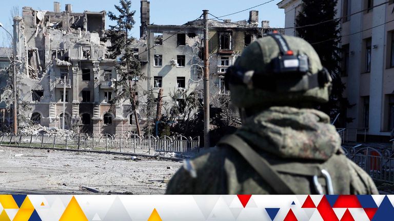 A service member of pro-Russian troops inspects the street during Ukraine-Russia conflict in the southern port city of Mariupol, Ukraine April 7, 2022. REUTERS/Alexander Ermochenko