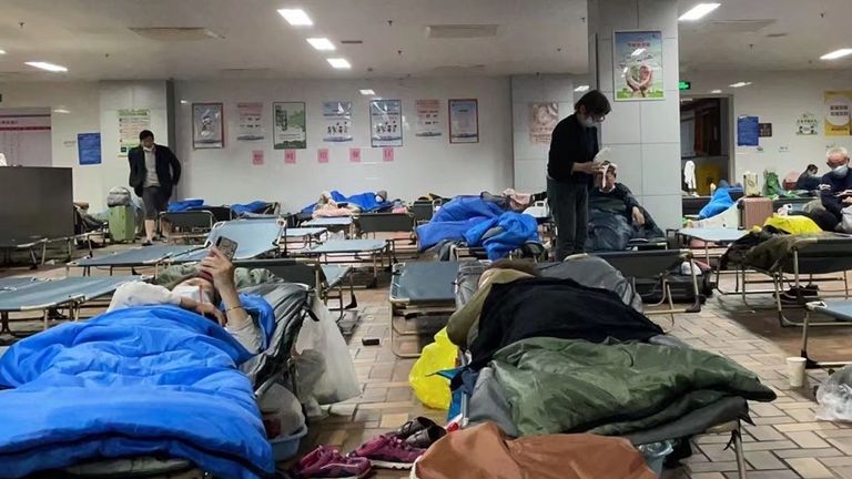 Elderly people are being housed in the canteen of an old school