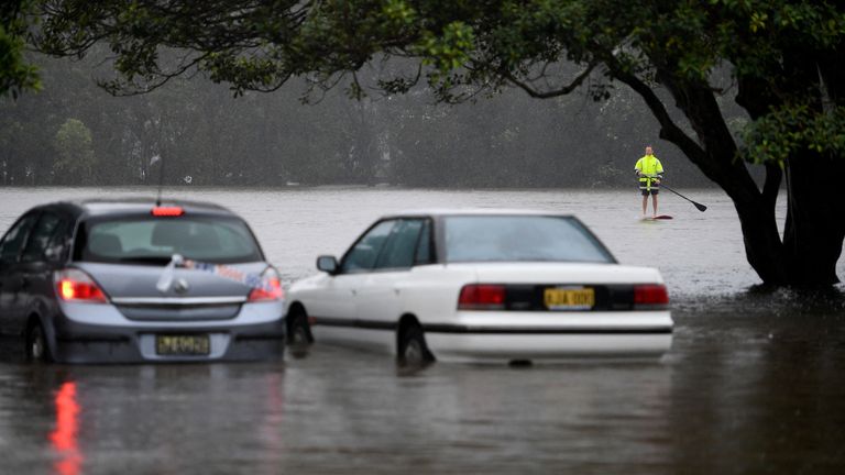 Cars submerged in Manley Creek, north of Sydney