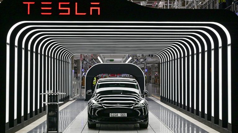 A Model Y Tesla electric vehicle stands on a conveyor belt at the opening of the Tesla Gigafactory Berlin Brandenburg.
PIC:AP