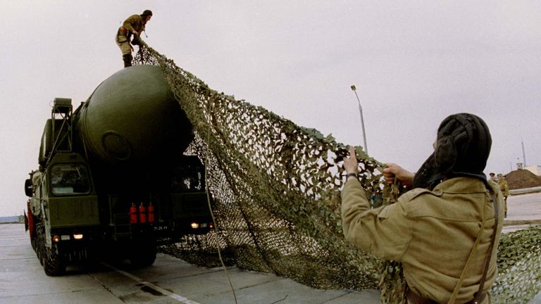 FILE PHOTO SEP96 - Russian officers take off the camouflage covering from a "Topol-12M" mobile nuclear missile at a strategic forces base near the central Russian city of Yoshkar-Ola. Defence Minister Igor Rodionov said on Thursday the country&#39;s armed forces were in such a "horrifying state" that the reliability of its nuclear weapons system was in doubt, Interfax news agency said. RUSSIA ARMS
