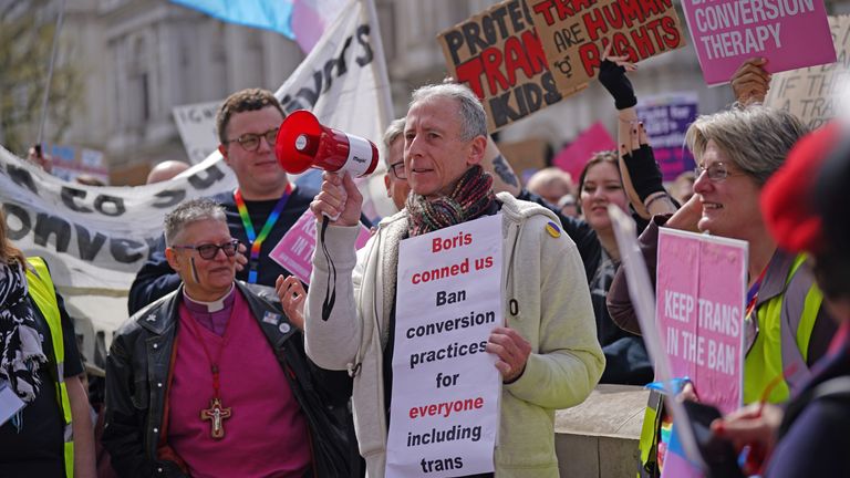 Peter Tatchell (centre) speaks during a protest outside Downing Street in London, over transgender people not being included in plans to ban conversion therapy. Picture date: Sunday April 10, 2022.