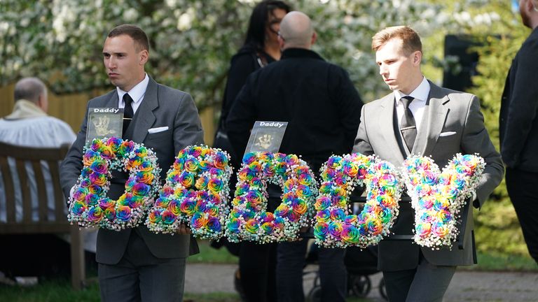 A floral tribute is carried into St Francis of Assisi church ahead of the funeral of The Wanted star Tom Parker in Queensway, Petts Wood, in south-east London, following his death at the age of 33 last month, 17 months after being diagnosed with an inoperable brain tumour. Picture date: Wednesday April 20, 2022.
