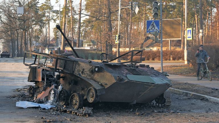 A charred armoured vehicle is seen on a street, as Russia&#39;s invasion of Ukraine continues, in the town of Bucha in the Kyiv region, Ukraine February 28, 2022. REUTERS/Maksim Levin

