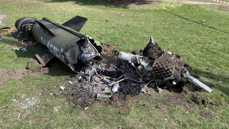 The remains of a ballistic missile lie on the grass outside the station in Kramatorsk

