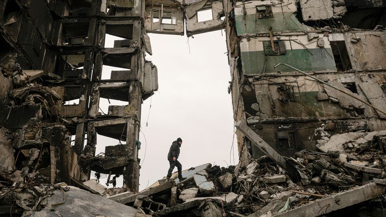 A resident looks for belongings in an apartment building destroyed during fighting between Ukrainian and Russian forces in Borodyanka, Ukraine, Tuesday, April 5, 2022. (AP Photo/Vadim Ghirda)


