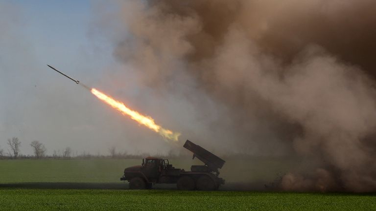 Ukrainian servicemen fire with a BM-21 Grad multiple rocket launch system in Luhansk region
