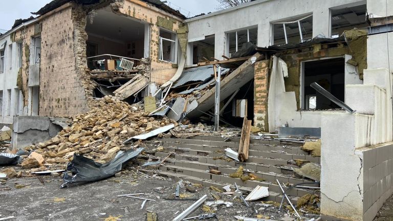 Bomb disposal teams arrive to destroyed homes where the walls are crumbling