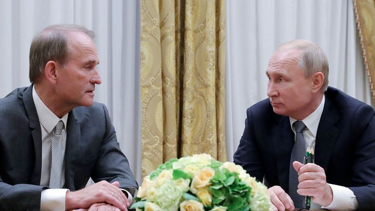 FILE PHOTO: Russia&#39;s President Vladimir Putin (R) attends a meeting with leader of Ukraine...s Opposition Platform - For Life party Viktor Medvedchuk in Saint Petersburg, Russia July 18, 2019. Sputnik/Mikhail Klimentyev/Kremlin via REUTERS  ATTENTION EDITORS - THIS IMAGE WAS PROVIDED BY A THIRD PARTY./File Photo