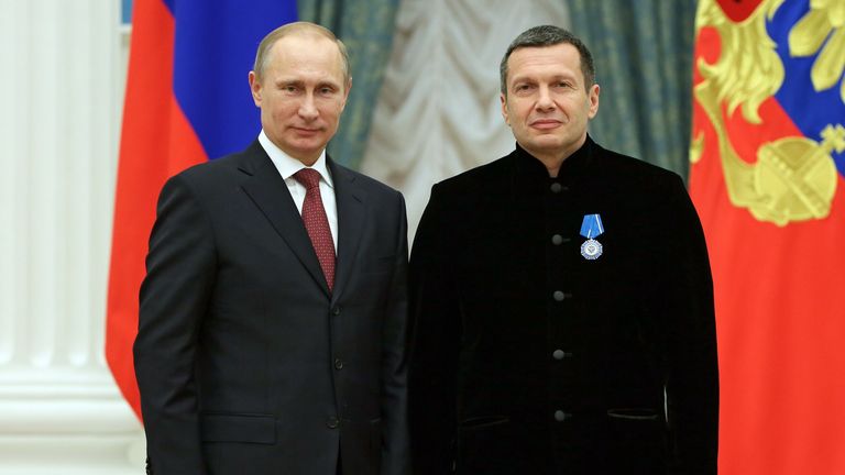 Vladimir Putin and broadcaster Vladimir Solovyov. Pic: AP