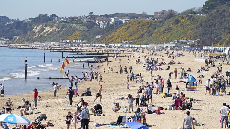 People enjoy the sun on Bournemouth beach in Dorset on Friday