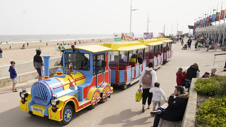 People on the seafront at Bridlington Beach in Yorkshire. Parts of the UK are enjoying warmer weather than usual on Easter Sunday as the spate of high temperatures continues. Picture date: Sunday April 17, 2022.

