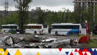 Buses wait for Ukrainian servicemen to transport them from Mariupol to a prison in Olyonivka after they leave the besieged Mariupol&#39;s Azovstal steel plant. Pic: AP