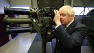 Boris Johnson with a shoulder launch missile system during a visit to Thales weapons manufacturer in Belfast