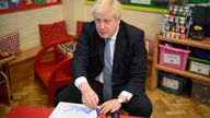 Prime Minister Boris Johnson paints with children during a visit at the Field End Infant school, in South Ruislip, following the local government elections. Picture date: Friday May 6, 2022.

