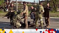 A still image taken from a video released by Russian Defence Ministry shows what it claims are service members of Ukrainian forces, who left the besieged Azovstal steel plant, being searched by the pro-Russian military in Mariupol, Ukraine. Video released May 17, 2022. Russian Defence Ministry/Handout via REUTERS ATTENTION EDITORS - THIS IMAGE WAS PROVIDED BY A THIRD PARTY. NO RESALES. NO ARCHIVES. MANDATORY CREDIT.