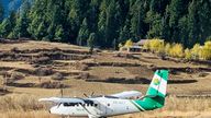 Handout image shows a Tara Air DHC-6 Twin Otter, tail number 9N-AET, in Simikot, Nepal December 1, 2021. Picture taken December 1, 2021. Madhu Thapa/Handout via REUTERS ATTENTION EDITORS - THIS IMAGE HAS BEEN SUPPLIED BY A THIRD PARTY. NO RESALES. NO ARCHIVES. MANDATORY CREDIT. THIS PICTURE WAS PROCESSED BY REUTERS TO ENHANCE QUALITY. AN UNPROCESSED VERSION HAS BEEN PROVIDED SEPARATELY.

