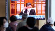 People watch a TV screen showing a file image of North Korean leader Kim Jong Un during a news program at a train station in Seoul, South Korea, Saturday, May 14, 2022. North Korea on Saturday reported 21 new deaths and 174,440 more people with fever symptoms as the country scrambles to slow the spread of COVID-19 across its unvaccinated population. (AP Photo/Ahn Young-joon)..  . 