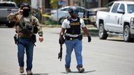 Police walk near the Robb Elementary school in Uvalde, Texas, Tuesday 24 May 2022 (AP Photo/Dario Lopez-Mills)..
