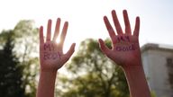 Alexa Steele holds up her hands with the words "My Body My choice" written on them during a protest in support of abortion rights after the leak of a draft majority opinion written by Justice Samuel Alito, preparing for a majority of the court to overturn the landmark Roe v. Wade decision later this year, in Boston, Massachusetts, U.S., May 3, 2022. REUTERS/Brian Snyder