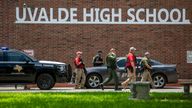 Law enforcement officials work Tuesday, May 24, 2022 at Uvalde High School after a shooting was reported earlier in the day at nearby Robb Elementary School.