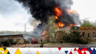 Smoke rises above a burning oil storage in the course of Ukraine-Russia conflict on the outskirts of Donetsk, Ukraine May 4, 2022. REUTERS/Alexander Ermochenko