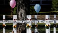 FILE PHOTO: A view of crosses with the names of victims of a school shooting, at a memorial outside Robb Elementary school, two days after a gunman killed nineteen children and two adults, in Uvalde, Texas, U.S. May 26, 2022. REUTERS/Marco Bello/File Photo
