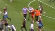 Manchester City have apologised after Aston Villa goalkeeper Robin Olsen was assaulted during a pitch invasion