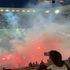 Saint-Etienne fans storm pitch and set off flares as players flee to locker room