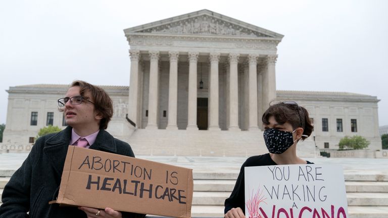 Demonstrators protest outside of the U.S. Supreme Court early Tuesday, May 3, 2022 in Washington. A draft opinion suggests the U.S. Supreme Court could be poised to overturn the landmark 1973 Roe v. Wade case that legalized abortion nationwide, according to a Politico report released Monday. Whatever the outcome, the Politico report represents an extremely rare breach of the court's secretive deliberation process, and on a case of surpassing importance. (AP Photo/Jose Luis Magana)