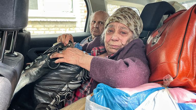 74-year-old Katarina is taken out of the town by police. She&#39;s sobbing the whole way through her departure.