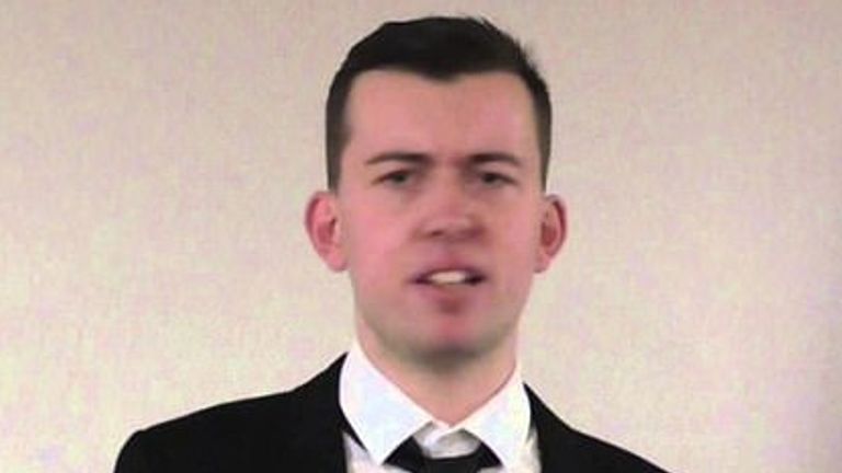 Alex Davies wearing a suit, in an image from the website of the extreme right-wing group the London Forum