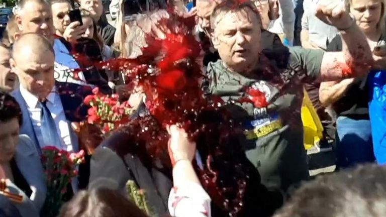 Footage showed Sergey Andreev covered in paint as protesters prevented the ambassador and others from laying a wreath.