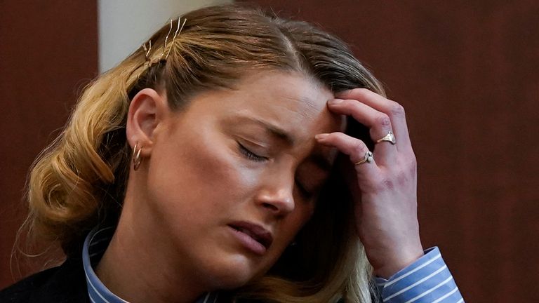 Actor Amber Heard testifies at Fairfax County Circuit Court during a defamation case against her by ex-husband, actor Johnny Depp in Fairfax, Virginia, U.S., May 4, 2022. Heard said there was an incident where Depp performed a cavity search while accusing her of harboring his drugs. REUTERS/Elizabeth Frantz/Pool
