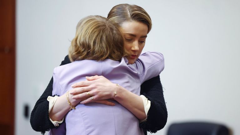 US actress Amber Heard embraces a member of her legal team as she arrives before the start of the day during the 50 million US dollar Depp vs Heard defamation trial at the Fairfax County Circuit Court in Fairfax, Virginia, USA, 05 May 2022. Johnny Depp&#39;s 50 million US dollar defamation lawsuit against Amber Heard that started on 10 April is expected to last five or six weeks.