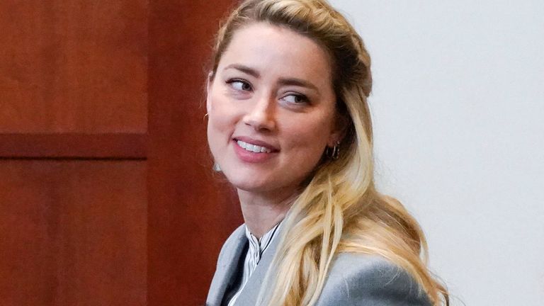 Actress Amber Heard leaves during a respite in the courtroom at the conclusion of arguments in her ex-husband Johnny Depp's defamation case at the Fairfax County Circuit Court in Fairfax, Virginia, USA, May 27, 2022. Steve Helber / Pool via REUTERS